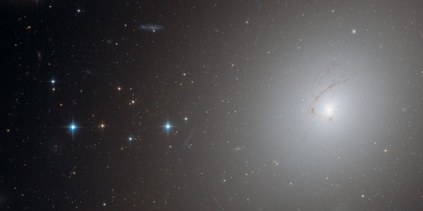 NGC 4696: Why Is It Shaped Like A Cosmic Question Mark?
